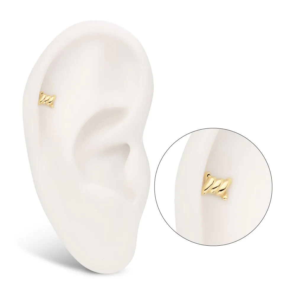 A 14k yellow gold barbed-wire style earring, as shown in a model ear, in the helix piercing location.