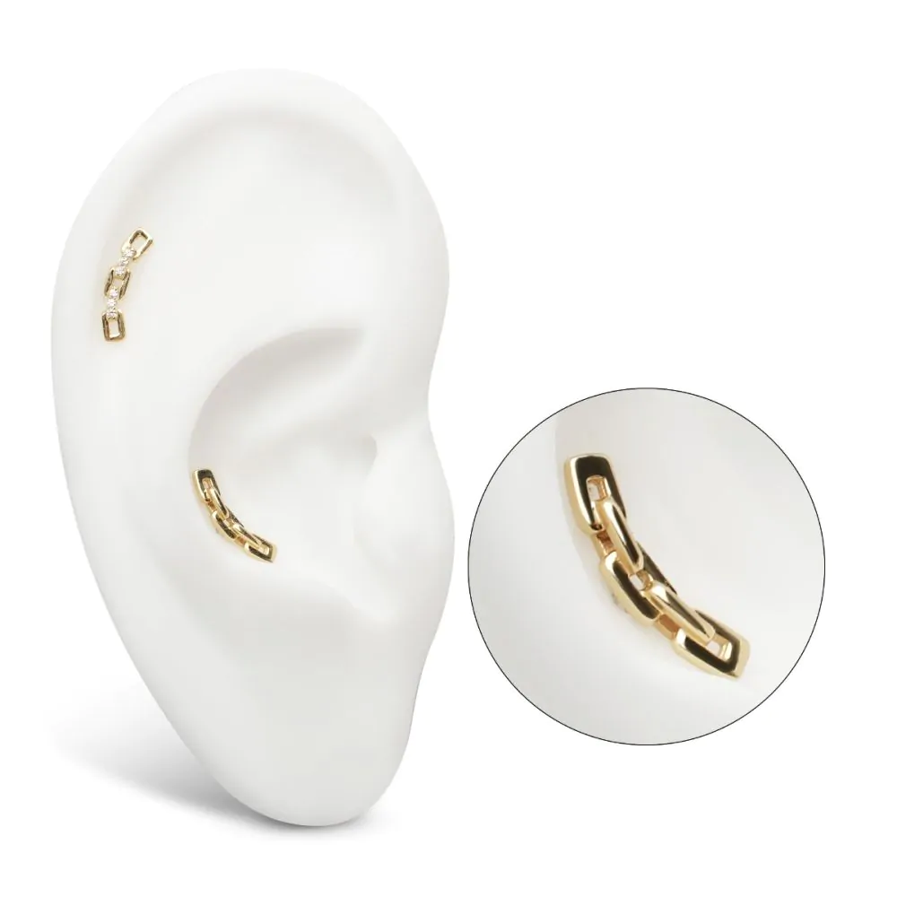 A 14k gold curved chain jewelry with a solid yellow gold finish, showing the curved chain design. Shown in the helix piercing and the conch piercing of a model ear, with a separate close-up shot of the jewelry.