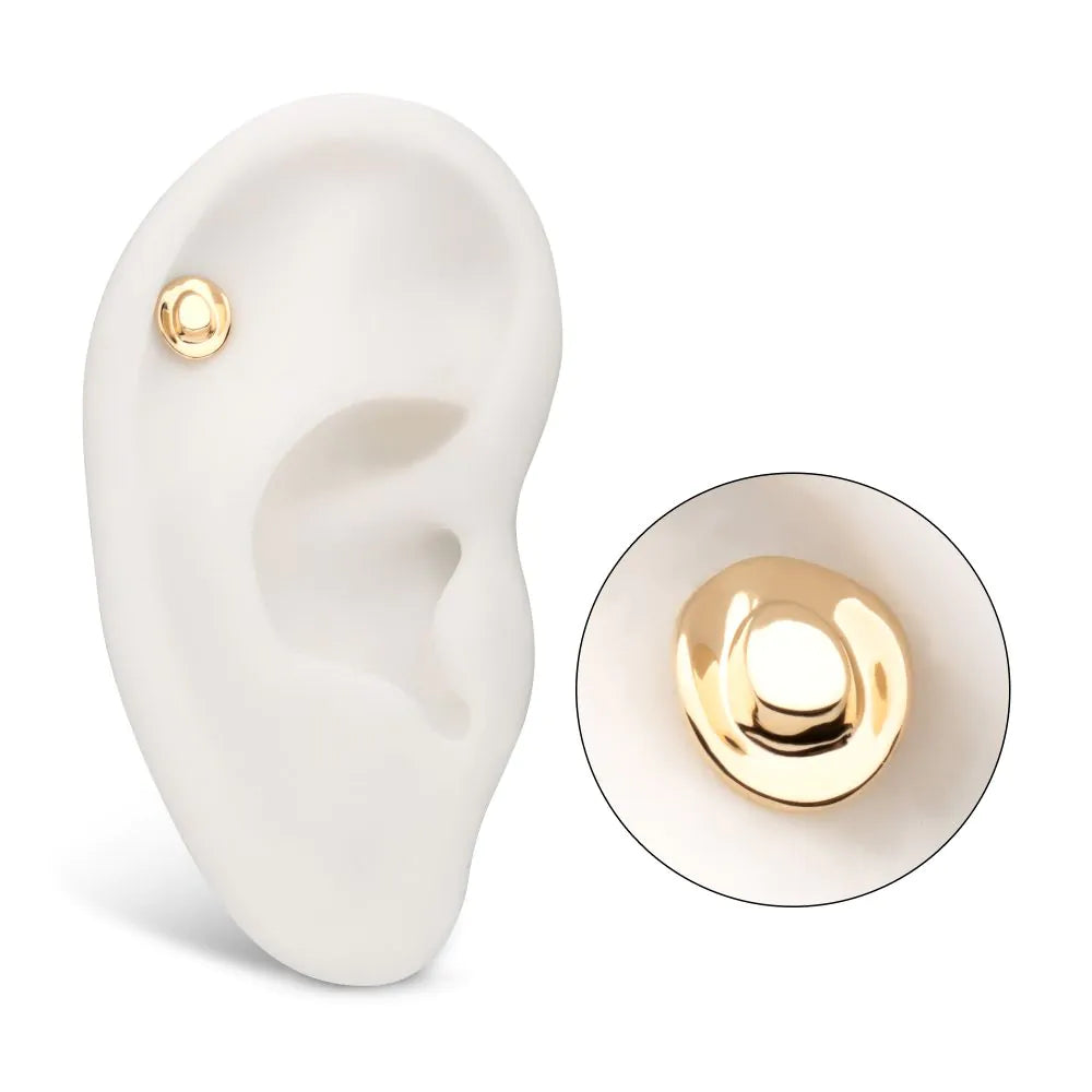 A cowboy hat-shaped gold earring, shown on display on a model ear, with a separate close-up shot.