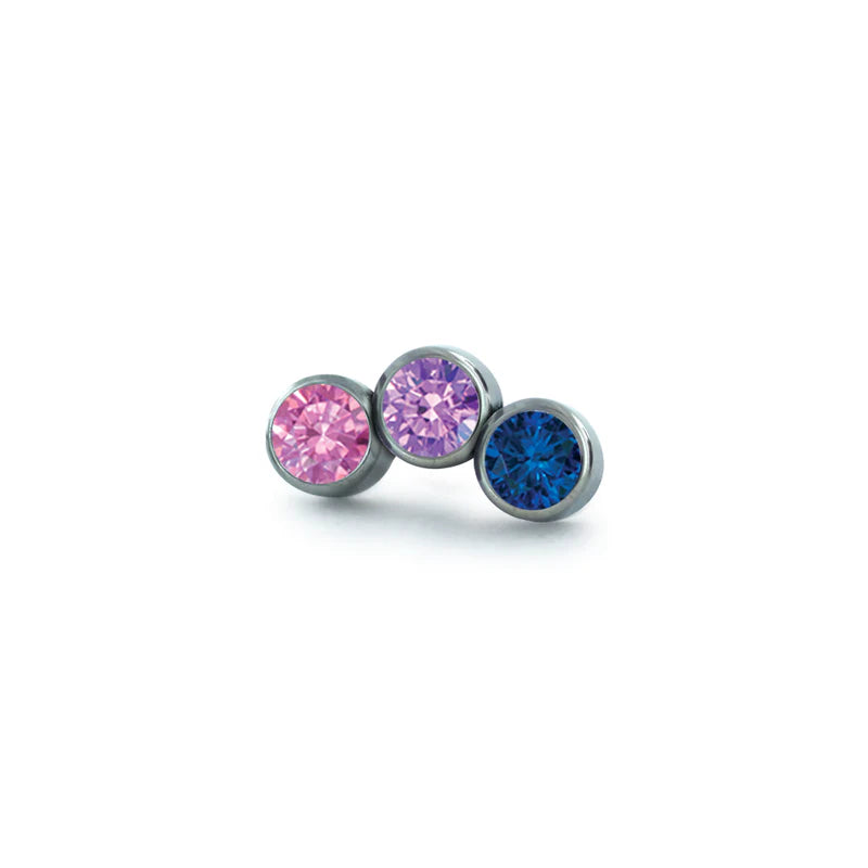 A close-up of a multi-gem earring.